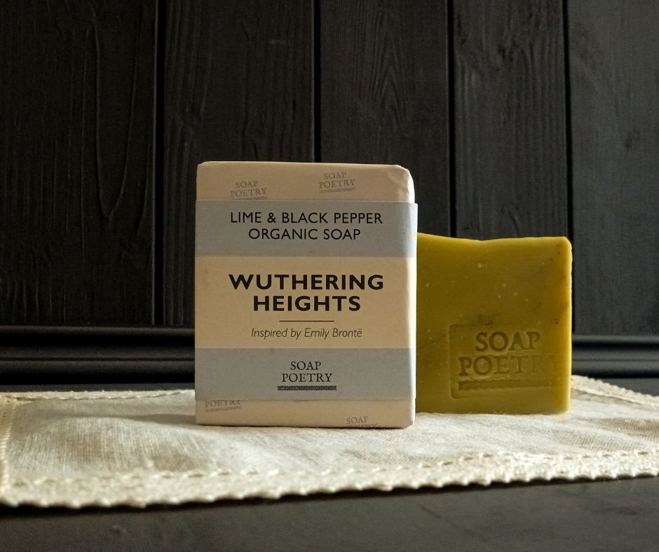 Bar of soap with packaging labeled 'Wuthering Heights' by The Soap Poetry on a dark wooden background.