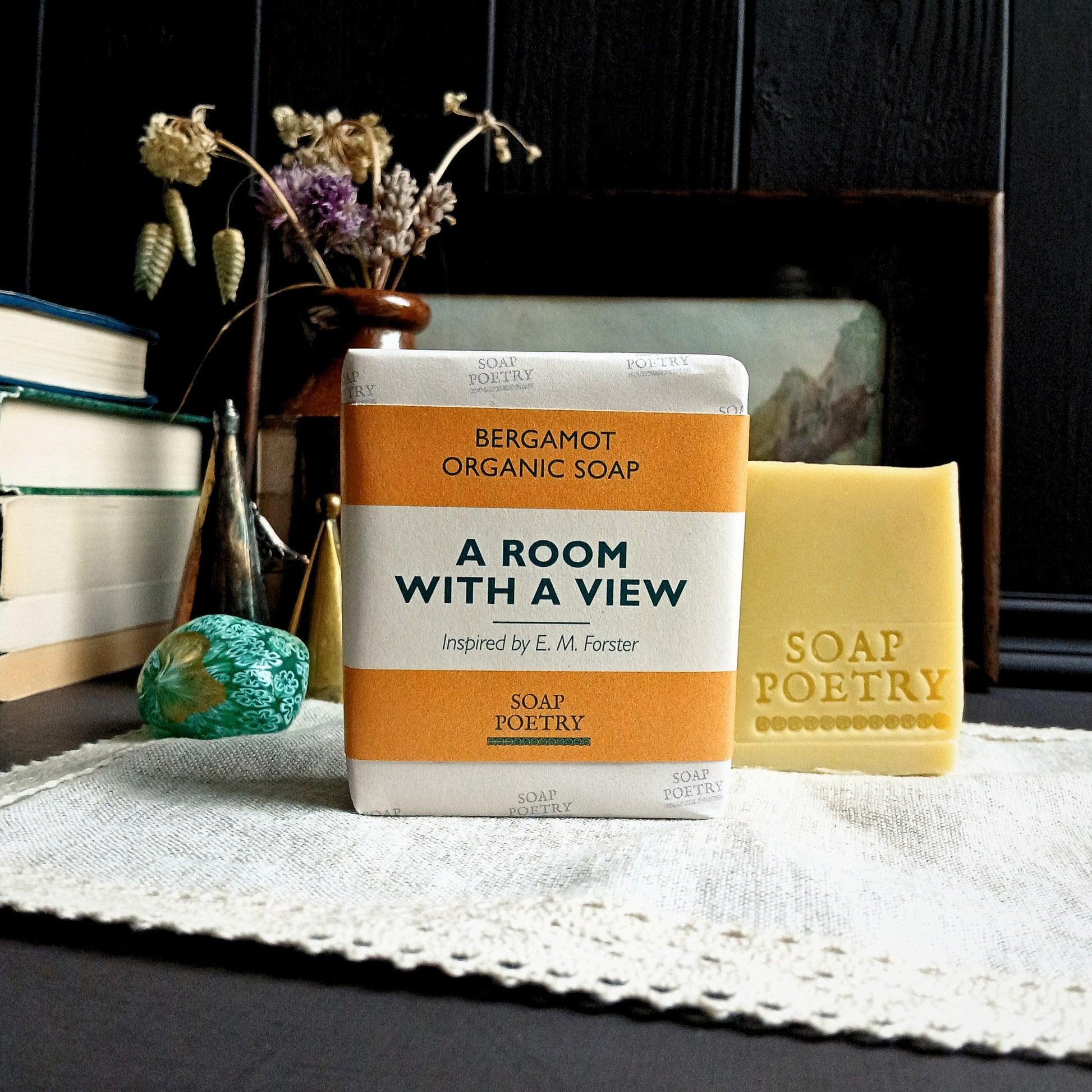 Soap Poetry Bergamot Organic Soap with packaging on a textured surface