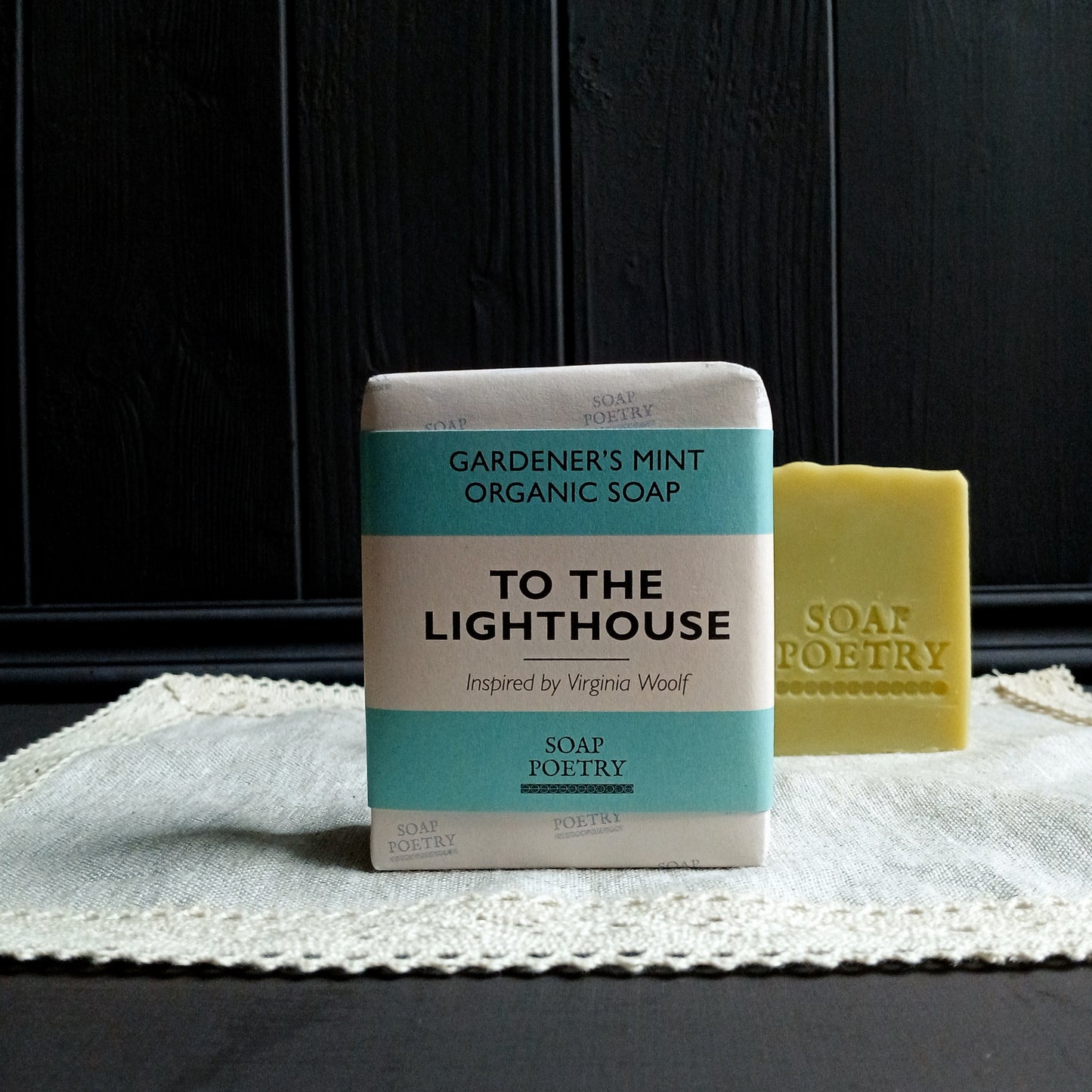 Bar of soap with a 'To the Lighthouse' packaging on a textured surface.
