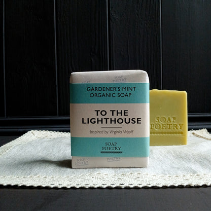 Bar of soap with a 'To the Lighthouse' packaging on a textured surface.