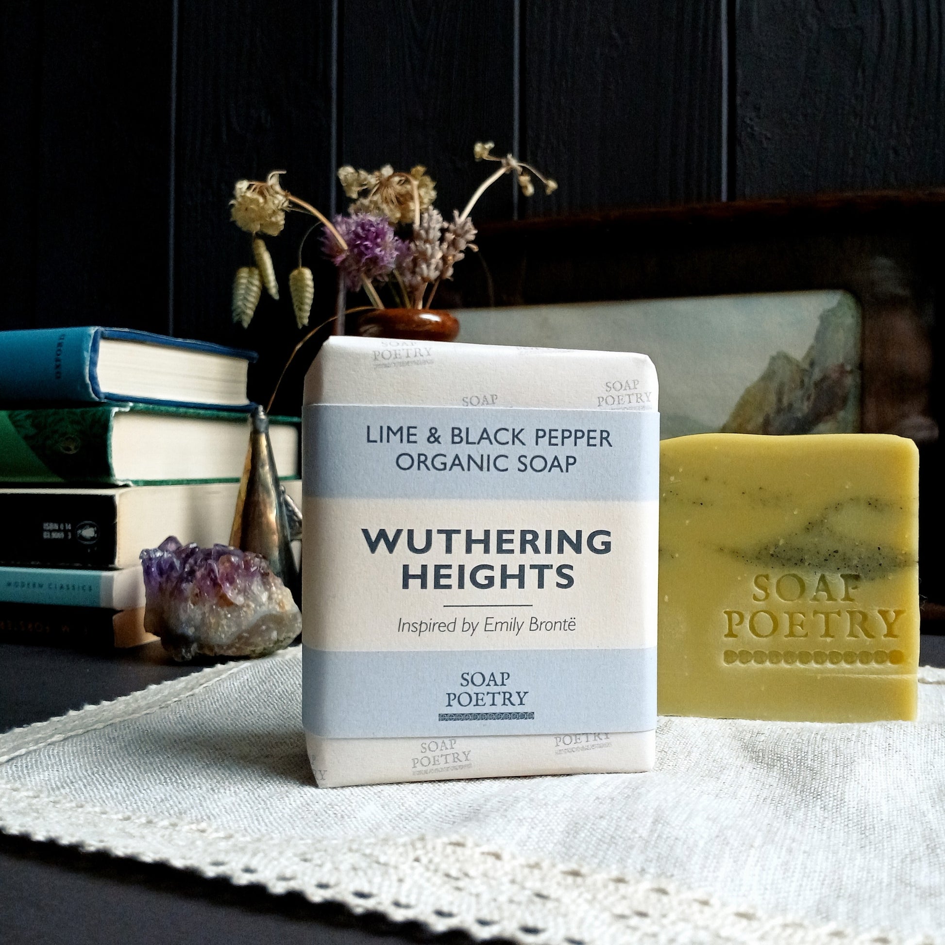 Soap Poetry 'Wuthering Heights' soap bar on a table with books and decorative items in the background.