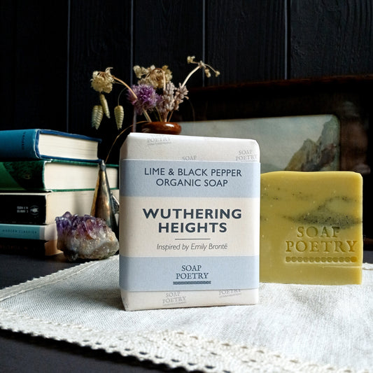 Soap Poetry 'Wuthering Heights' soap bar on a table with books and decorative items in the background.